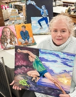 Julie Heffers Holding One Of Her Oil Paintings, Background: Julie Heffers&#8217; Oil Paintings