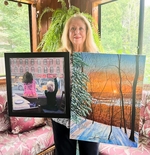 Sue Nardone Holding Her Paintings