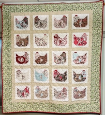 Quilt With Green Floral Border With Red Edging, Gold Polka Dot On Tan Colored Center Background, Chicken Patterned Squares In Primary Colored Floral Pattern On A White Background, &#8220;Nesting&#8221; By Leslie Horoshko